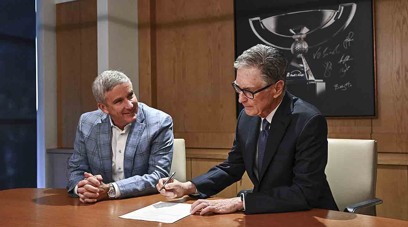 PGA Tour commissioner Jay Monahan and John Henry, Principal, Fenway Sports Group, sign an agreement announcing the launch of PGA Tour Enterprises in partnership with Strategic Sports Group (SSG) Jan. 31, 2024, in Ponte Vedra Beach, Florida.